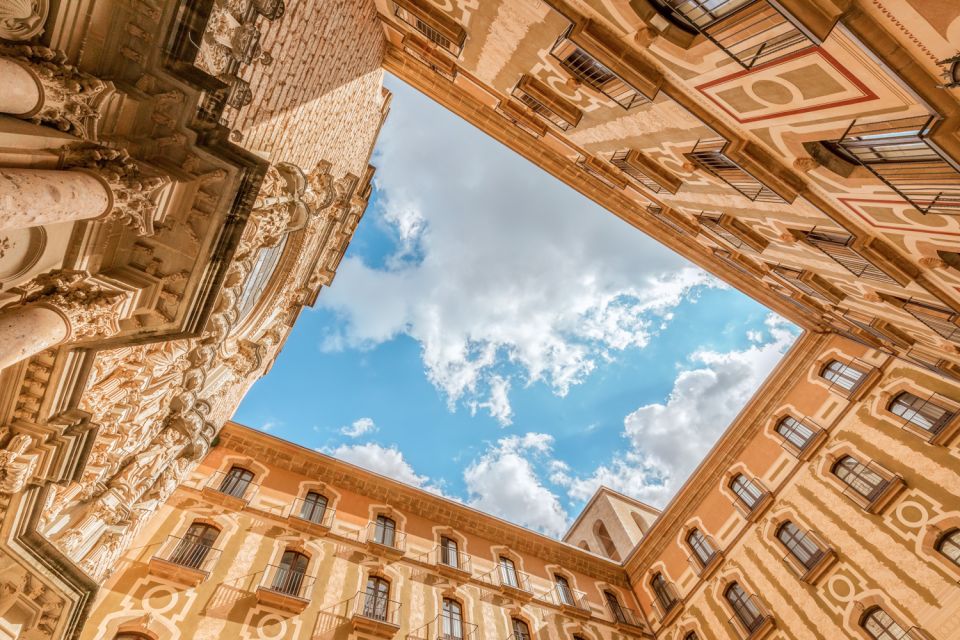 From Barcelona: Montserrat Guided Tour & Return Bus Transfer - Meeting Point