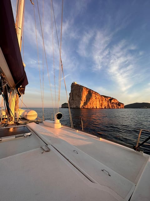 Sunset Sailing Trip Along Alghero Coastline With Apéritif - Water Sports Opportunities