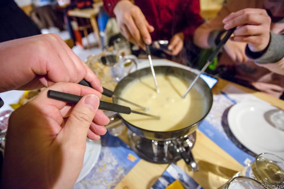 From Interlaken: Night Sledding With Cheese Fondue Dinner - Enjoying Cheese Fondue After Sledding