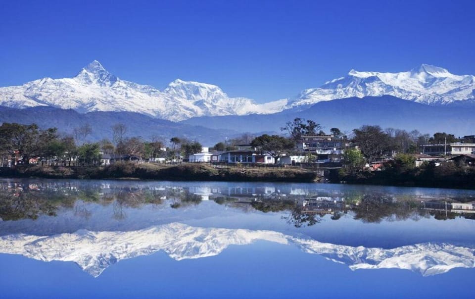 Pokhara: Himalayan Peaks, Lake, Stupa and Caves Car Tour - Tranquility on Fewa Lake