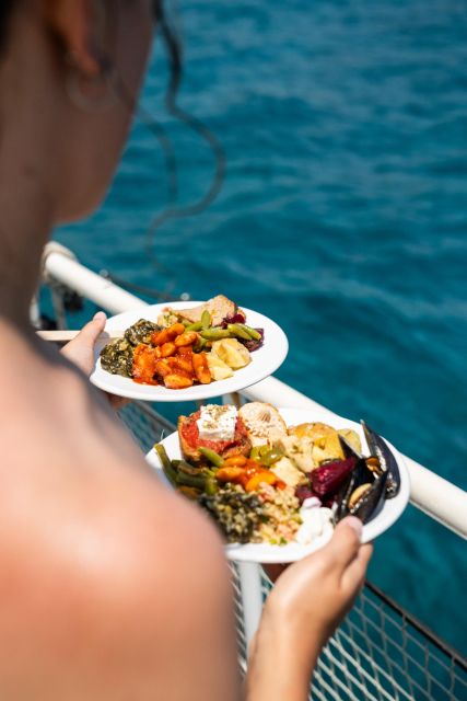 Rhodes: Bay to Bay Swim Cruise With Greek Buffet and Wine - Booking and Cancellation