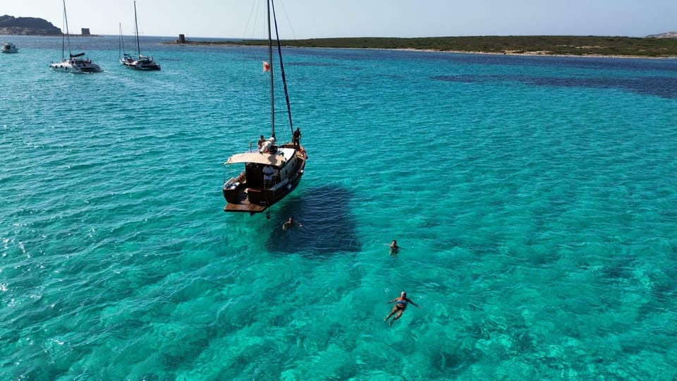 EXCURSION IN THE ASINARA PARKIN A WOODEN SAILING BOAT - Key Points