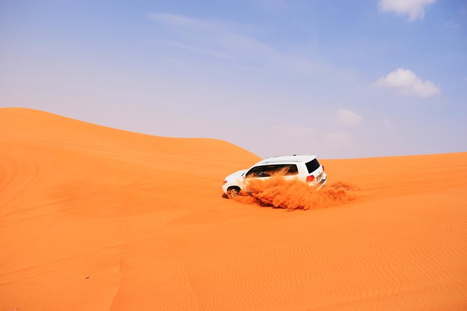 Desert Safari Dubai With BBQ Dinner and Belly Dance - Experience Dune Bashing