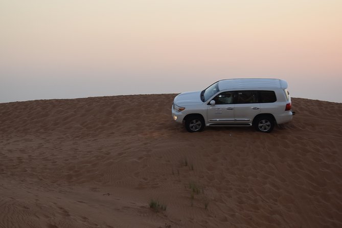 Dune Bashing With Quad Bike and Sand Boarding From Dubai - Experience Overview