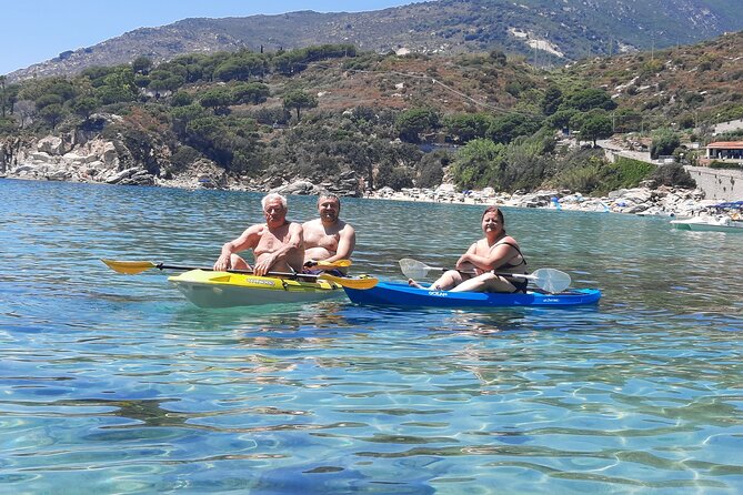Excursion in the Crystalline Sea of the Island of Elba in Sup and Canoe