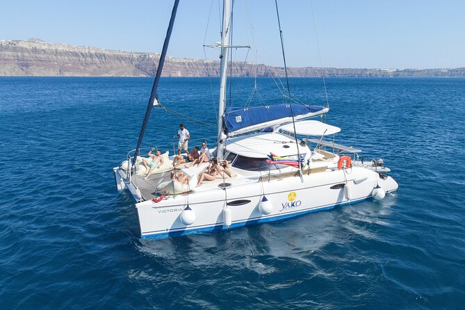Full Day Santorini Catamaran Private Cruise With Meal and Transfer - Activities Aboard the Catamaran