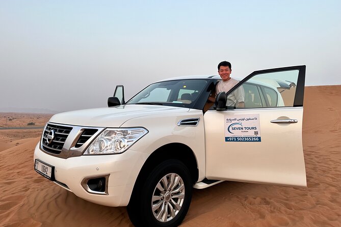 Dubai Desert Safari With Camel Ride Sand Board & BBQ Dinner - Sandboarding Thrills