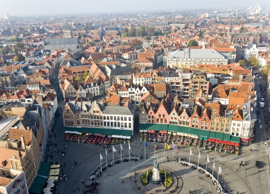 From Amsterdam: Day Trip to Bruges in Spanish or English - Tour Guide and Language Options