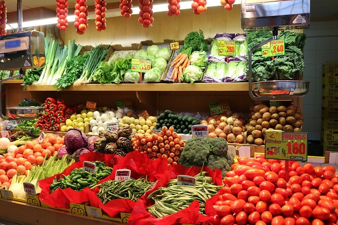 Tour Paella and Malaga Market With an Official Guide - Visiting Three Restaurants