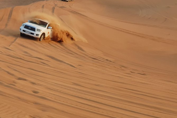 Dubai: Desert Safari, Quad Bike, Camel Ride, and Buffet Dinner - Dining and Entertainment