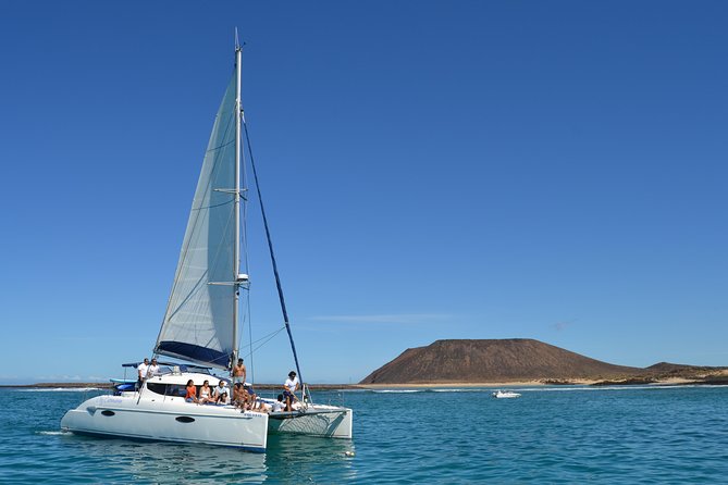 Exclusive Sailing Catamaran Experience to Lobos Island With Lunch and Drinks - Meeting Point and Pickup