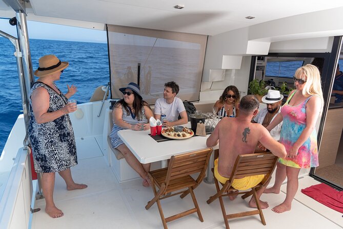 Hersonissos Sunset Catamaran Cruise With Finger Food & Drinks - Pricing and Booking Details
