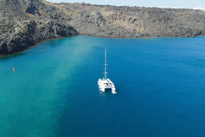 Full Day Santorini Catamaran Private Cruise With Meal and Transfer - Snorkeling Equipment Provided
