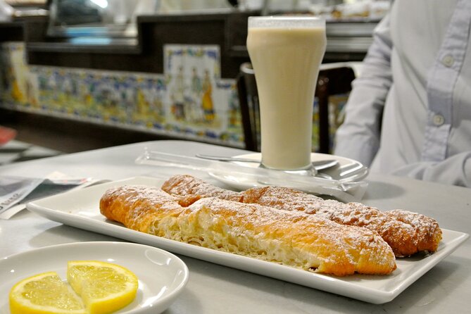 Highlights of Valencia Half-Day Private Tour With Local Tasting - Indulging in Local Delicacies