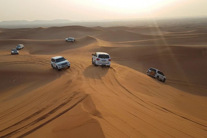 Dubai: Desert Safari, Quad Bike, Camel Ride, and Buffet Dinner - Pricing and Cancellation