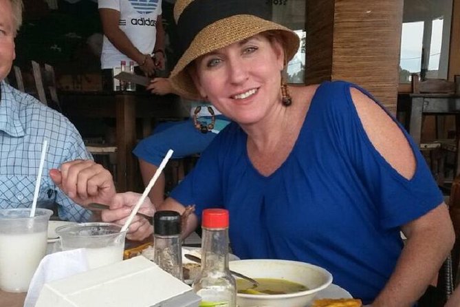 Medellin City Tour Including Barrios and Food Tasting - Admiring Plaza Botero