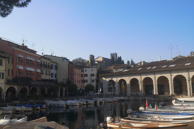 Desenzano Sunset Walking and Boat Tour With a Drink on Board - Boat Ride Along the Coast