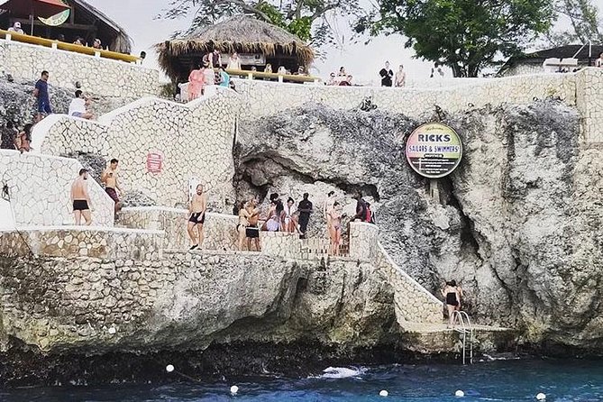 Bamboo Rafting and Limestone Foot Massage With Ricks Cafe Private Tour - Pickup and Transportation