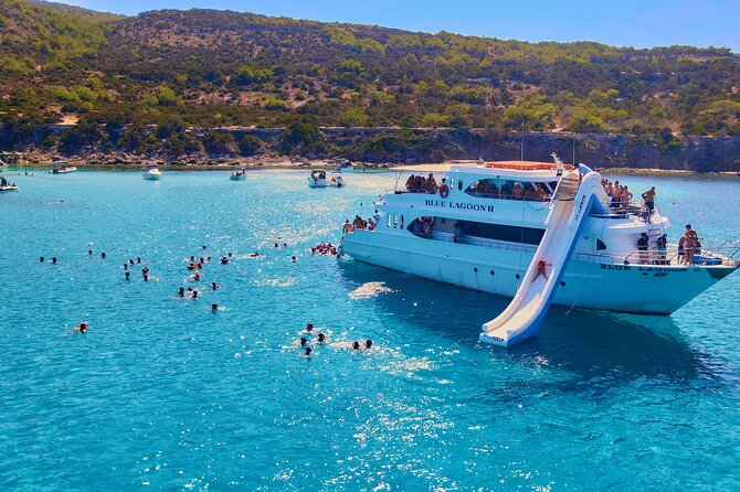 Blue Lagoon (Akamas) From Paphos With Water Slide and Aircon - Boat and Amenities