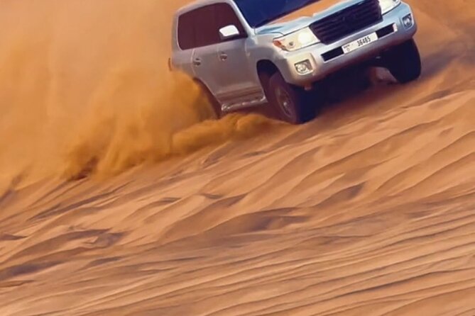 Evening Desert Safari With BBQ Buffet Camel Ride and Arabic Shows - Sandboarding in the Camp Area