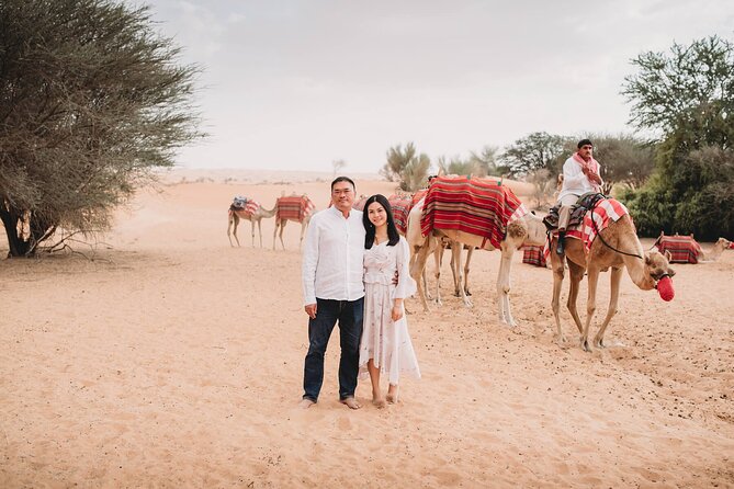 Red Dunes Dubai Desert Safari With Live Show, Sandboarding & BBQ - Camel Rides and Sandboarding Fun