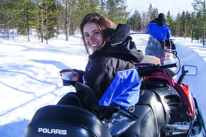 Snowmobile Safari in the Forest - Scenic Landscapes and Natural Vistas