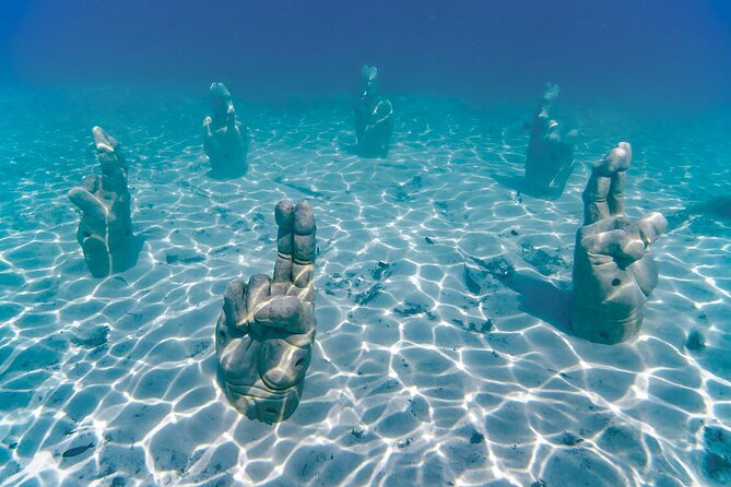 Top Isla Mujeres Catamaran Tour With Snorkel Open Bar and Buffet Lunch - Transportation Details