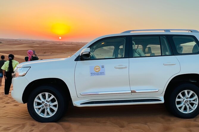 Desert Safari Tour With Camel Ride and BBQ Dinner in VIP Camp - Pickup and Transportation