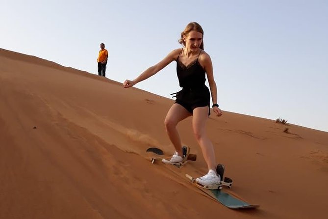 PRIVATE Dubai Desert Safari With BBQ Dinner, Camel Ride, Sand Boarding & Shows - Pricing and Group Size