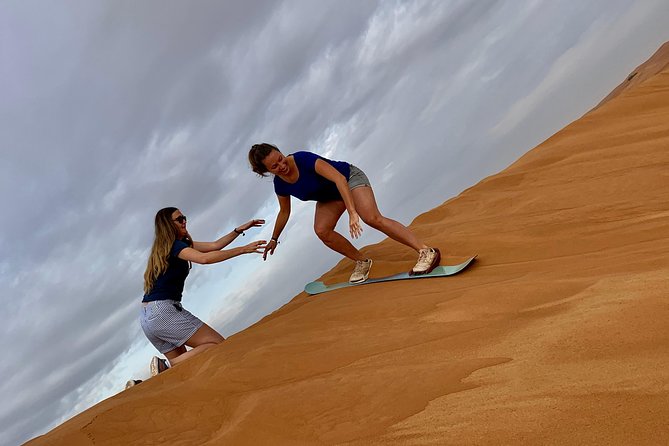 Dubai Red Dunes Quad Bike Tour,Sandboard, Camel Ride & BBQ Dinner