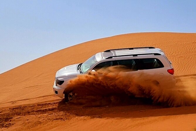 The Ghost Village Safari Tour With Dune Bashing and Sandboarding