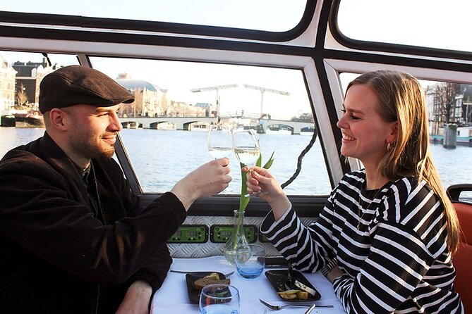 Experience Amsterdam Nightlife on Canal Cruise With Cheese & Wine - Discover the UNESCO Heritage Ring