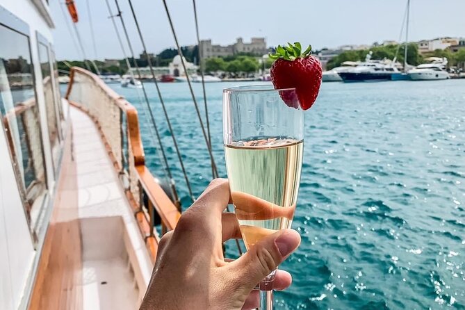 Rhodes by Sunset Cruise With Unlimited Drinks and Snacks - Inclusions and Amenities