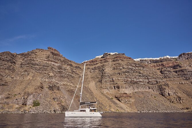 Santorini Oia: Caldera Luxury Sunset Cruise With BBQ & Drinks - Accessibility and Group Size