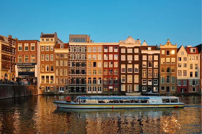 Experience Amsterdam Nightlife on Canal Cruise With Cheese & Wine - Onboard Amenities and Refreshments