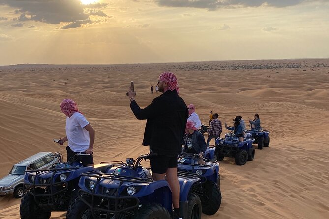 Dubai Red Dunes Quad Bike Tour,Sandboard, Camel Ride & BBQ Dinner - Exploring the Desert Landscape