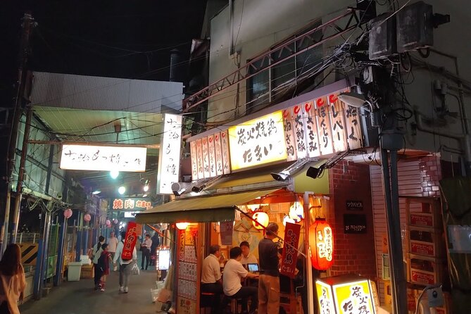Izakaya Hopping Night Tour in Nostalgic Area - Savoring Local Specialties