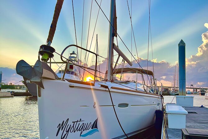Private Sunset Sailing With Dolphin and History Tours on Mystique - Pricing, Booking, and Cancellation Policy