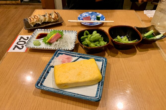 Osaka Nights: Ultimate Pub Bar Crawl With an Expert Local Guide - Savoring the Flavors of Osakas Culinary Delights