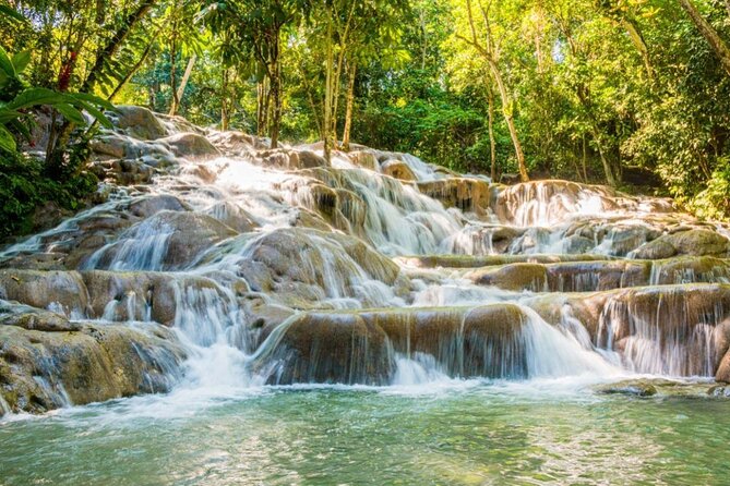 Party Catamaran With Dunns River Climb From Montego Bay - Key Points