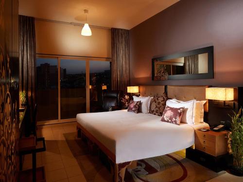 ZiQoo Hotel Apartments Dubai - Room Types and Amenities