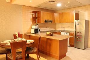 Al Manar Grand Hotel Apartment - Accommodation and Amenities