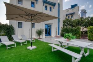 Stunning Palm Villa With Rooftop Garden and Pool by Exclusive Holiday Homes - House Rules and Policies