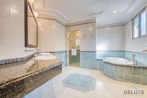 Breath-Taking 5BR Villa With Assistants Room and Private Pool in Frond E Palm Jumeirah by Deluxe Holiday Homes - About Your Stay