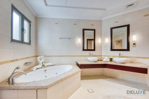Immaculate 4BR Villa With Assistant Room and Private Pool at Frond O Palm Jumeirah by Deluxe Holiday Homes - About Your Stay