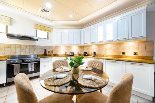 Palm Jumeirah Beachfront Private Pool Villa 5 BR & 1 Maids Room With Access to Beach - About Your Stay
