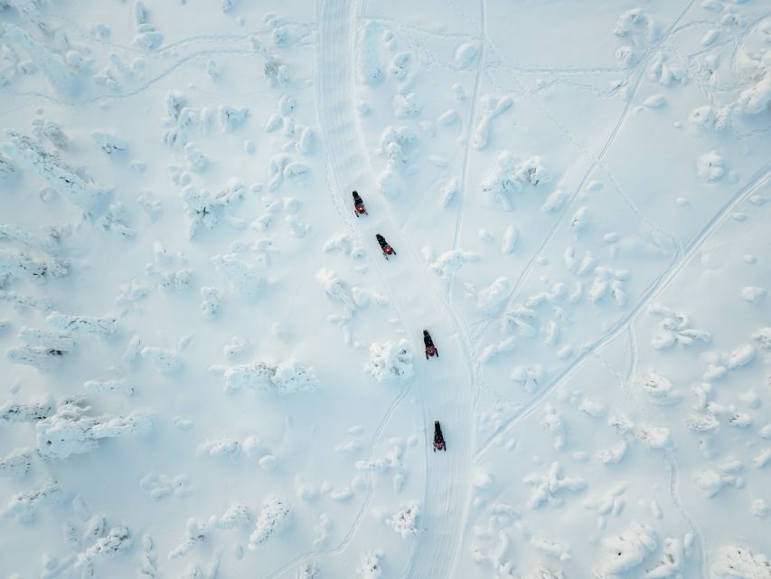 Levi: Snowmobile Safari with Ice Fishing and Outdoor Lunch - Snowmobiling Through the Wilderness