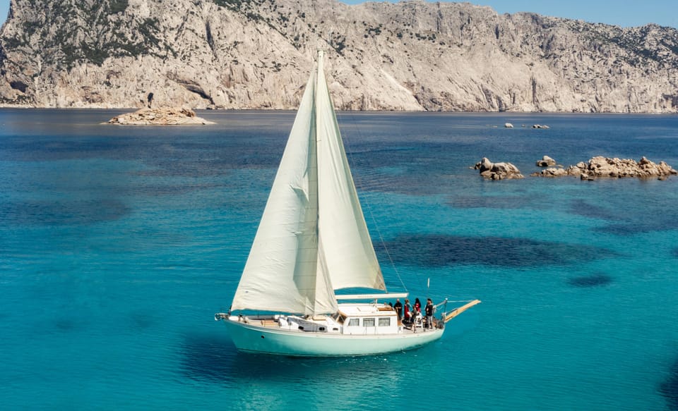 TAVOLARA TOUR WITH 15 METERS VINTAGE SAILBOAT WITH APERITIF - Authentic Experiences and Real-Life Tips