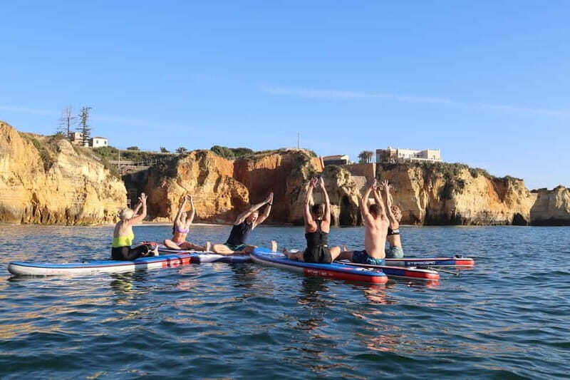 Lagos: Sunrise SUP Yoga Experience at Praia dos Estudantes - The Sum Up