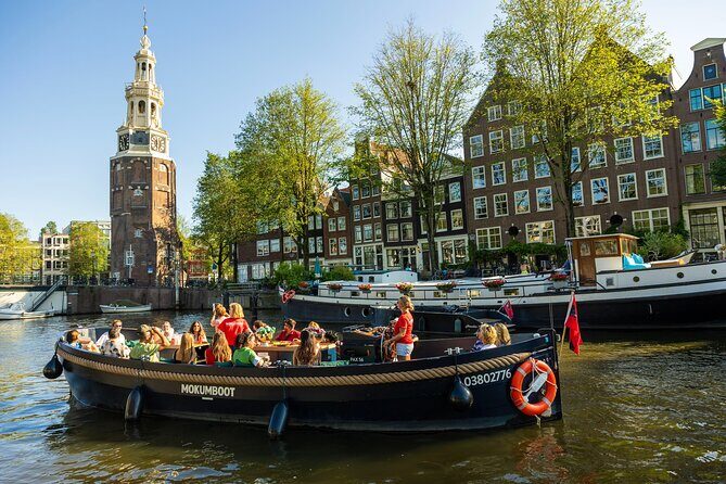 Amsterdam: Guided Open Boat Canal Cruise Including 1 Drink - The Itinerary and Stops: What You’ll See and Experience